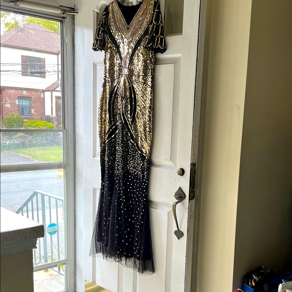 SHEIN Beautiful black with Gold Accents gown
Never worn.
